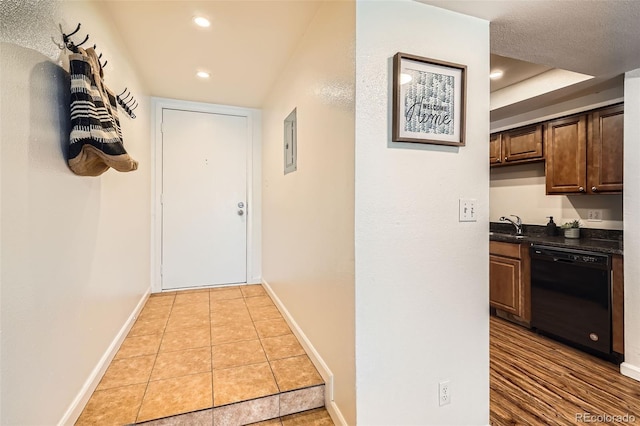 701 Harlan St Unit E59, Lakewood, CO 80214 - corridor featuring a sink, baseboards, electric panel, and recessed lighting