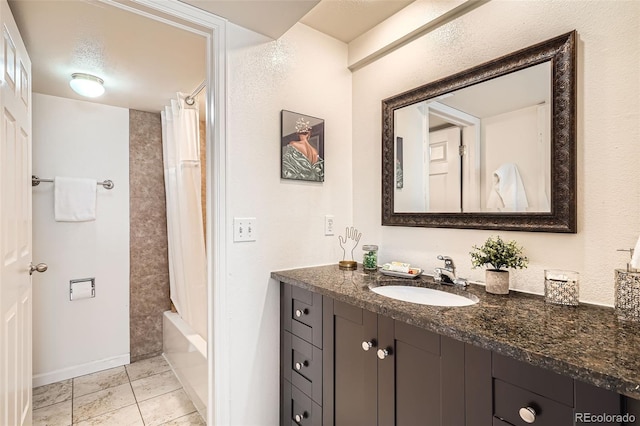 701 Harlan St Unit E59, Lakewood, CO 80214 - full bathroom with tile patterned floors, shower / bath combo, and vanity