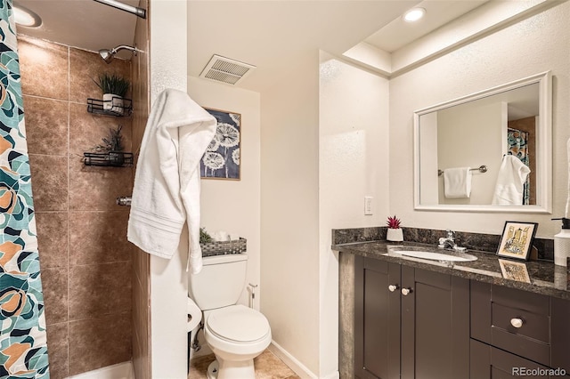 701 Harlan St Unit E59, Lakewood, CO 80214 - full bath with visible vents, vanity, toilet, and tiled shower