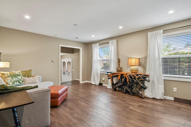 sitting room featuring wood finished floors, baseboards, and recessed lighting