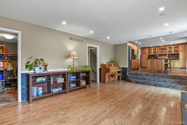 living room with recessed lighting and light wood finished floors