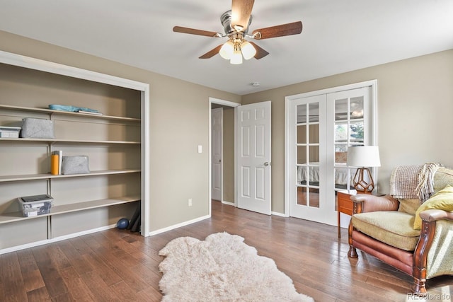 living area with french doors, wood finished floors, ceiling fan, and baseboards