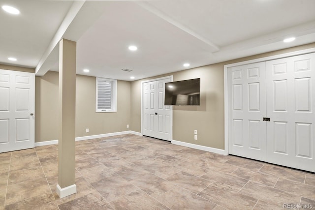 finished basement featuring baseboards and recessed lighting