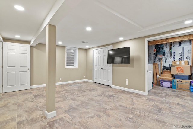 finished basement featuring baseboards and recessed lighting