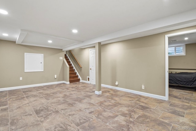 basement with recessed lighting, stairway, and baseboards