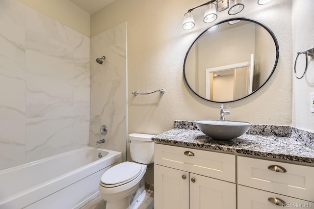 5677 S Park Pl Unit A308, Englewood, CO 80111 - bathroom with vanity, tub / shower combination, and a textured wall