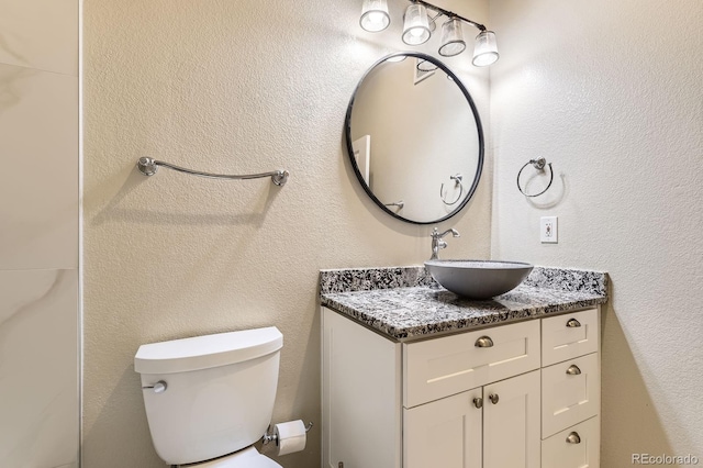 5677 S Park Pl Unit A308, Englewood, CO 80111 - bathroom featuring vanity and toilet