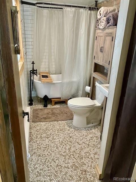 640 Ridgeway Dr, Cotopaxi, CO 81223 - bathroom featuring shower / bath combination with curtain and tile patterned floors