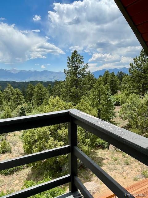 640 Ridgeway Dr, Cotopaxi, CO 81223 - balcony with a wooded view and a mountain view