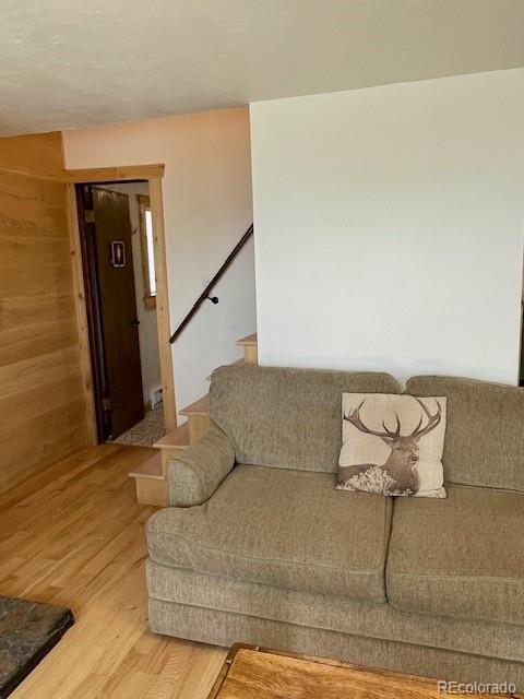 640 Ridgeway Dr, Cotopaxi, CO 81223 - living area with light wood-style flooring and stairs