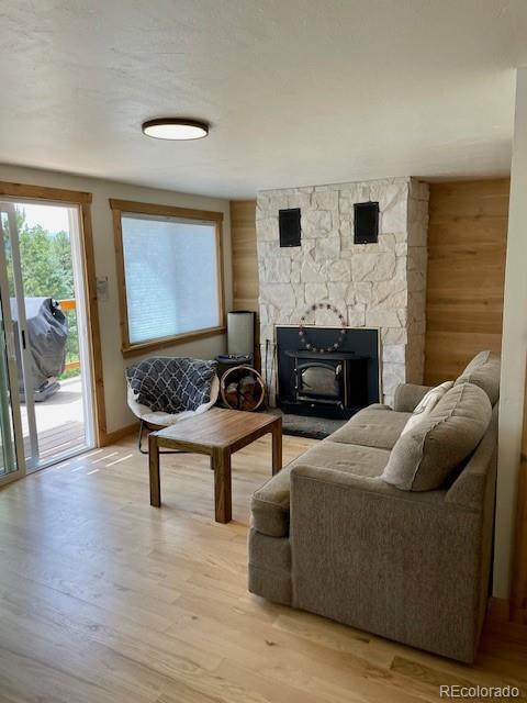 640 Ridgeway Dr, Cotopaxi, CO 81223 - living room with light wood finished floors and a wood stove