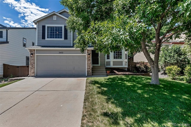 2602 Cove Creek Ct, Highlands Ranch, CO 80129 - view of front of home featuring concrete driveway, an attached garage, and brick siding