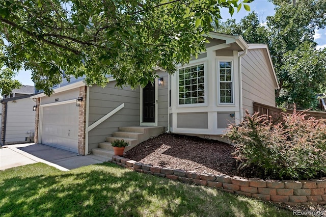 2602 Cove Creek Ct, Highlands Ranch, CO 80129 - view of front of home featuring driveway, a garage, and entry steps