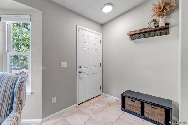 2602 Cove Creek Ct, Highlands Ranch, CO 80129 - entrance foyer with light tile patterned floors and baseboards