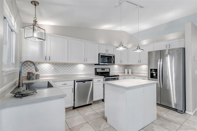 2602 Cove Creek Ct, Highlands Ranch, CO 80129 - kitchen featuring appliances with stainless steel finishes, light countertops, tasteful backsplash, light tile patterned flooring, and vaulted ceiling