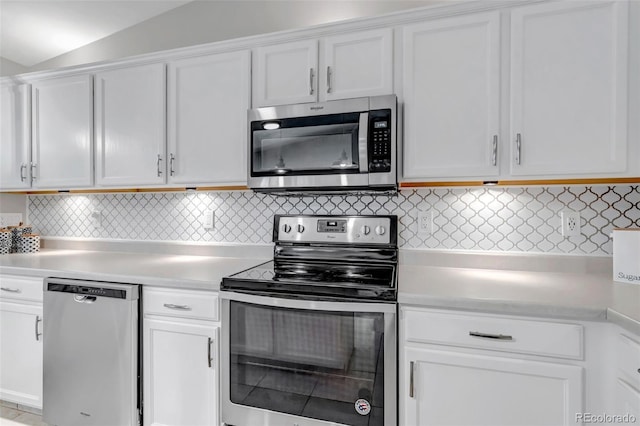 2602 Cove Creek Ct, Highlands Ranch, CO 80129 - kitchen featuring appliances with stainless steel finishes, light countertops, white cabinets, and backsplash