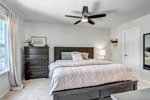 2602 Cove Creek Ct, Highlands Ranch, CO 80129 - bedroom featuring light colored carpet, multiple windows, and ceiling fan