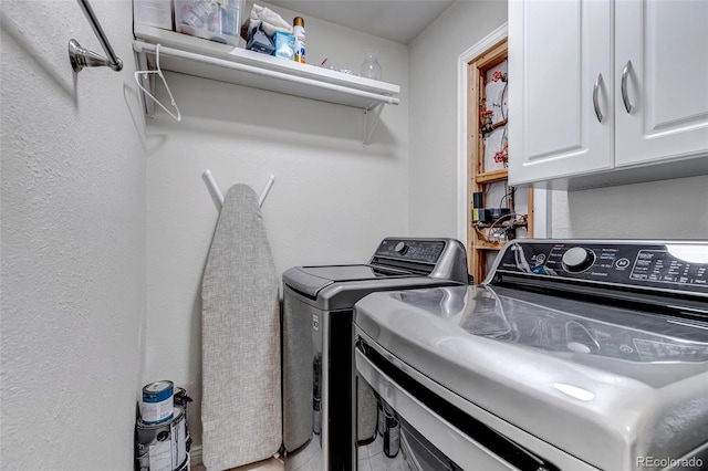 2602 Cove Creek Ct, Highlands Ranch, CO 80129 - laundry room featuring cabinet space and independent washer and dryer