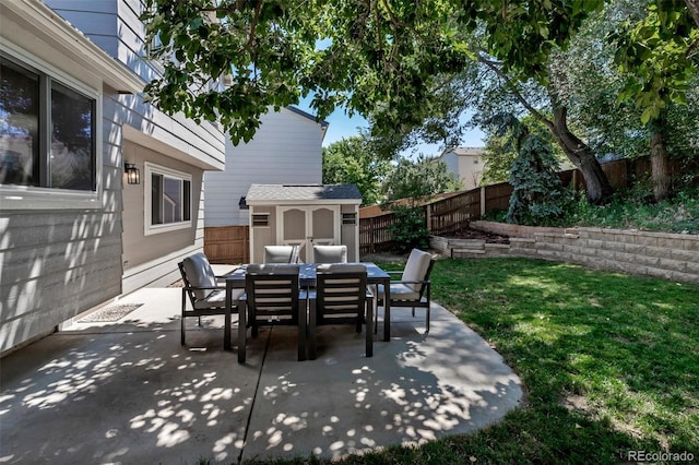 2602 Cove Creek Ct, Highlands Ranch, CO 80129 - fenced backyard with outdoor dining area, a shed, and a patio