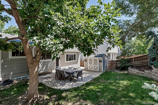 2602 Cove Creek Ct, Highlands Ranch, CO 80129 - fenced backyard featuring a storage unit and a patio area