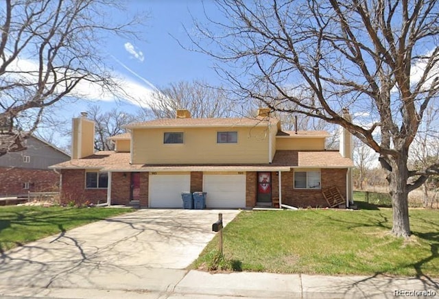 983 Xenon, Golden, CO 80401 - traditional home with a front yard, a garage, concrete driveway, brick siding, and a chimney