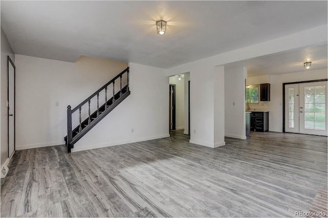 unfurnished living room with light hardwood / wood-style flooring