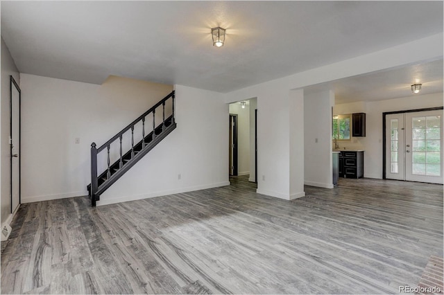 983 Xenon, Golden, CO 80401 - unfurnished living room with wood finished floors and stairs