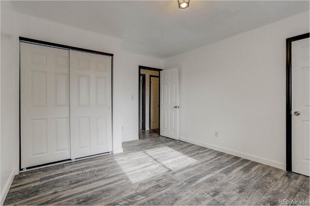 983 Xenon, Golden, CO 80401 - unfurnished bedroom with wood finished floors and a closet