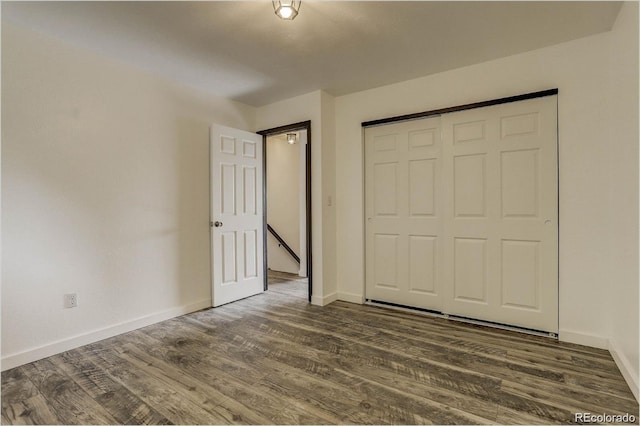 983 Xenon, Golden, CO 80401 - unfurnished bedroom with dark wood-style floors and a closet