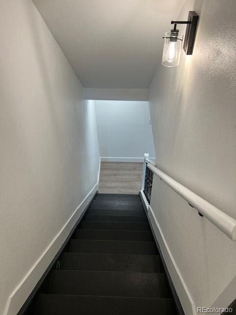 983 Xenon, Golden, CO 80401 - stairs featuring wood finished floors and baseboards