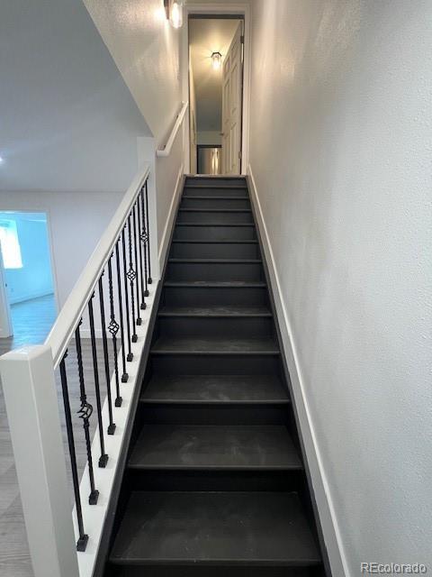 983 Xenon, Golden, CO 80401 - staircase featuring baseboards