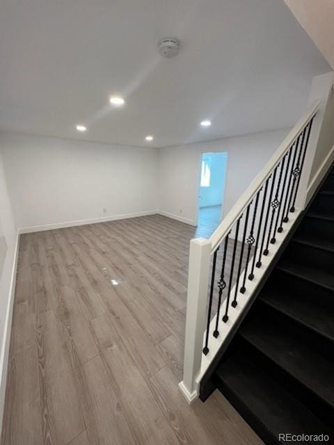 983 Xenon, Golden, CO 80401 - basement with wood finished floors, recessed lighting, and stairway