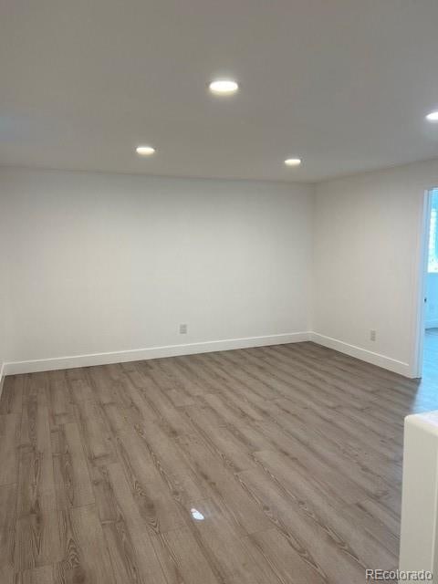 empty room with hardwood / wood-style floors