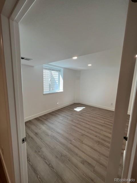 unfurnished room with light hardwood / wood-style flooring