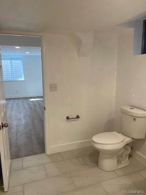 983 Xenon, Golden, CO 80401 - bathroom featuring baseboards and toilet