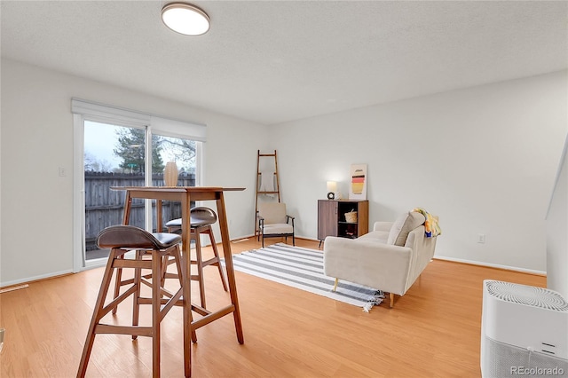 interior space with light wood-style floors and baseboards