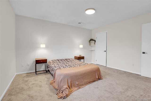 carpeted bedroom featuring baseboards