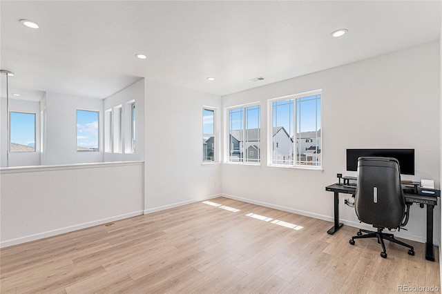 home office featuring wood finished floors, baseboards, visible vents, and recessed lighting