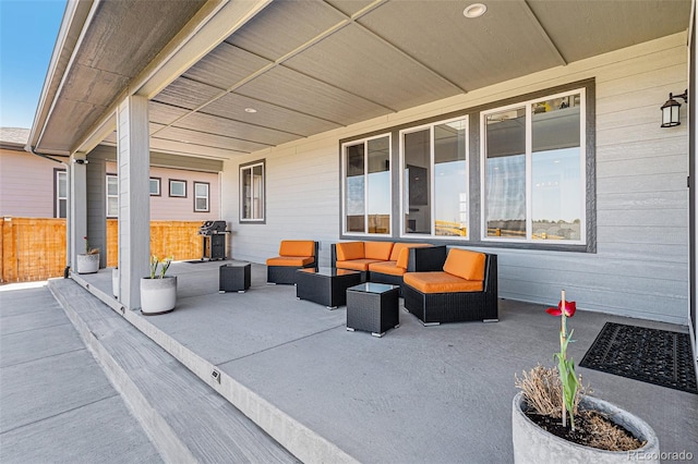 view of patio with grilling area and an outdoor living space