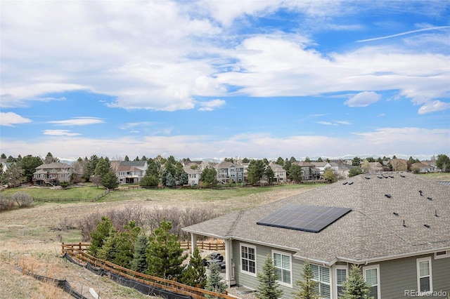 exterior space with a residential view and fence