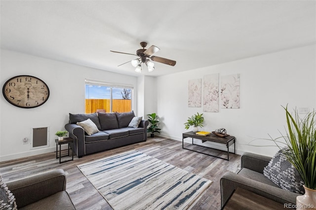 647 Berwick Ave, Firestone, CO 80520 - living area with a ceiling fan and wood finished floors