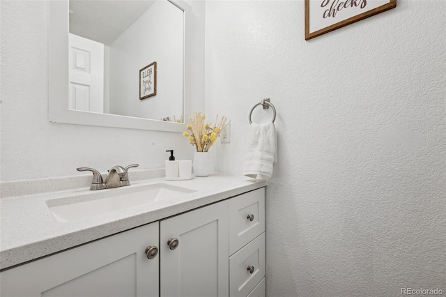 647 Berwick Ave, Firestone, CO 80520 - bathroom featuring vanity and a textured wall