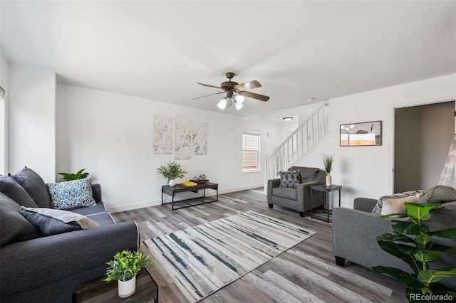 647 Berwick Ave, Firestone, CO 80520 - living room featuring stairway, wood finished floors, and ceiling fan