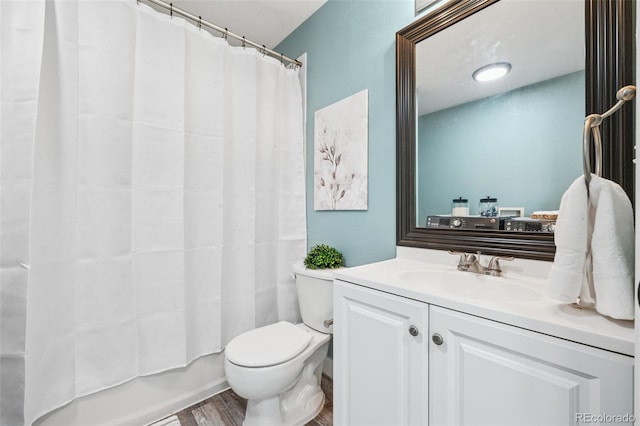 647 Berwick Ave, Firestone, CO 80520 - full bath with vanity, wood finished floors, and shower / bath combo with shower curtain