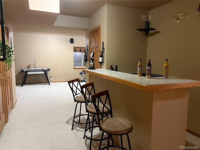 bar featuring light colored carpet