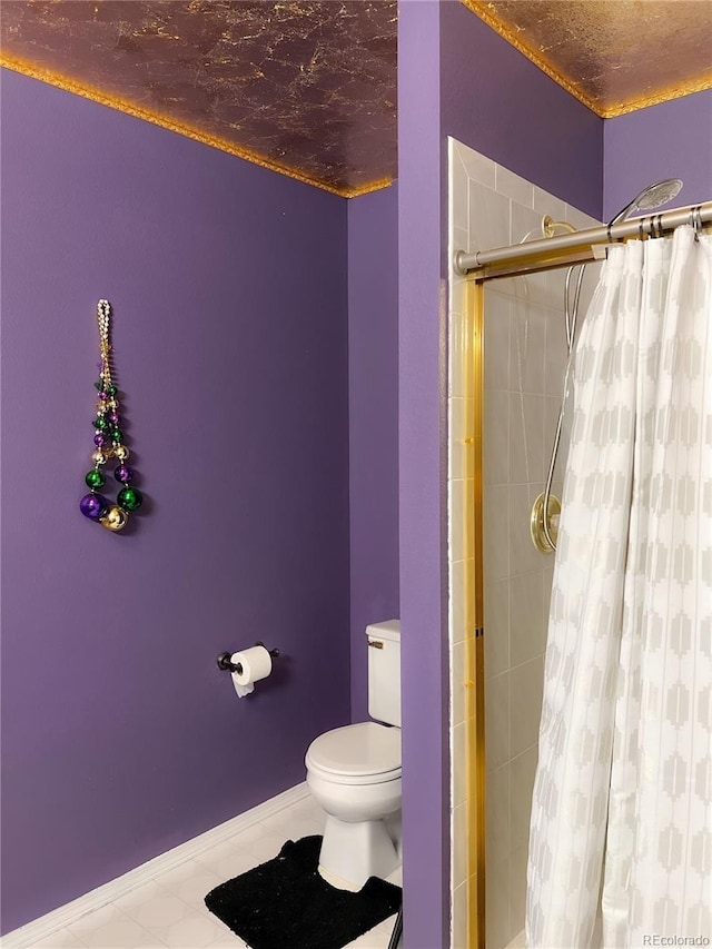 bathroom with toilet and walk in shower