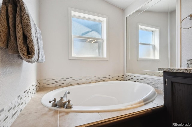 bathroom with tiled tub