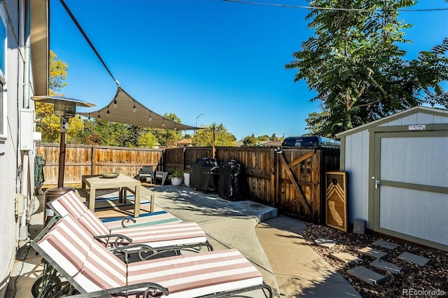 view of patio with a shed