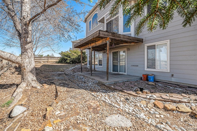 exterior space featuring a patio area and fence