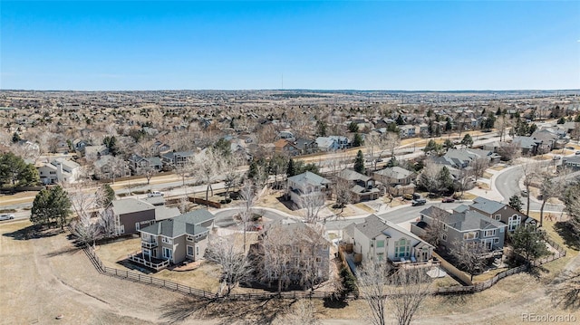 birds eye view of property with a residential view